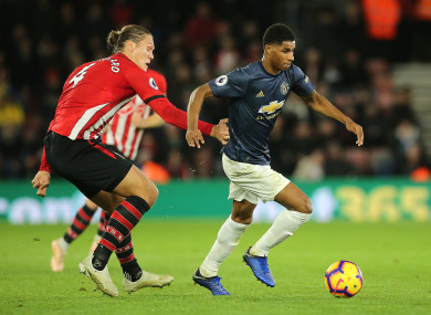Southampton's Jannik Vestergaard (left) and Manchester United's Marcus Rashford (right) battle for the ball.