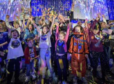 Celebrations with school children at the John Hopkins University Applied Physics Laboratory, Maryland at the moment the spacecraft passed the object.