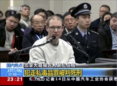 In this image taken from a video footage run by China's CCTV via AP Video, Canadian Robert Lloyd Schellenberg attends his retrial.