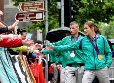 Olympic silver medalist John Joe Nevin and gold medalist Katie Taylor greet Irish fans after the 2012 Games in London.