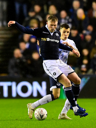 Everton's Lucas Digne and Ireland striker Aiden O'Brien compete for possession.