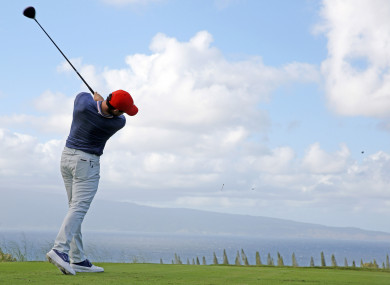 Rory McIlroy tees off on the 18th hole at Kapalua Resort.