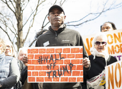 A demonstrator in Atlanta, Georgia protests against Donald Trump's declaration of a national emergency to fund a border wall with Mexico
