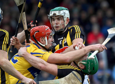Clare's Ian Galvin tackled by Paddy Deegan and Paul Murphy of Kilkenny.