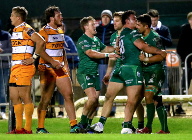 Connacht's Kieran Marmion and Dominic Robertson-McCoy celebrate with try-scorer Jarrad Butler.