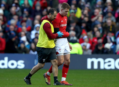 Liam Williams helped off the field after being run down by Allan Dell.