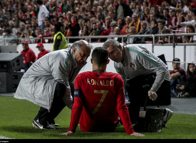 Ronaldo receiving treatment during his side's draw against Serbia.
