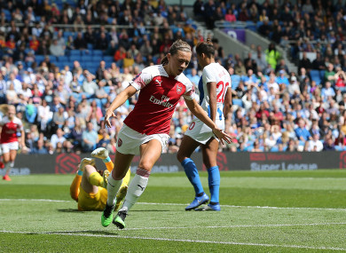 McCabe celebrates scoring against Brighton at the AMEX Stadium.