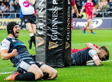 Ospreys celebrate as Olly Cracknell dives over for his side's second try.