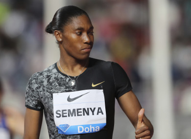 Caster Semenya gives a thumps up as she arrives to compete in the women's 800-meter final during the Diamond League in Doha, Qatar.