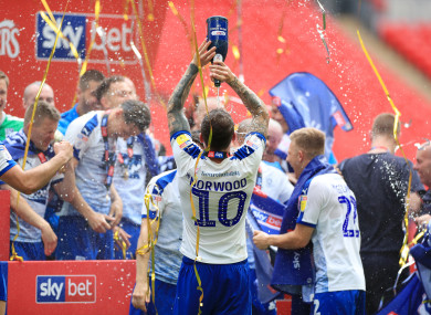 Tranmere players celebrate their dramatic play-off victory at Wembley.