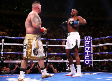 Anthony Joshua inhales after recovering from a knockdown against Andy Ruiz.
