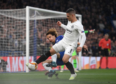 Jovic shields the ball from Chelsea defender David Luiz during their Europa League encounter.
