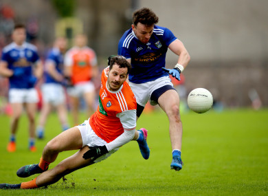 Jamie Clarke and Conor Moynagh battling for possession in the Ulster SFC semi-final.