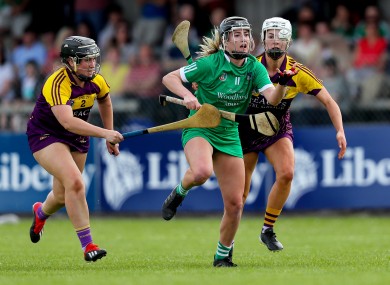 Limerick's Rebecca Delee with Wexford's Shauna Sinnott and Linda Bolger.