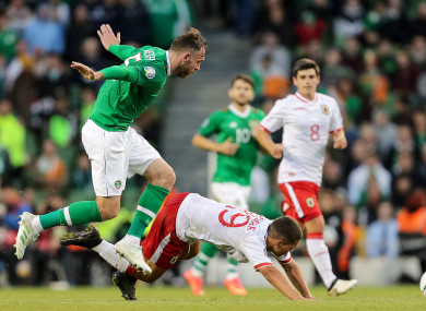 Ireland's Richard Keogh and Tjay De Barr of Gibraltar.