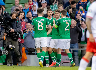 Sean Maguire (8) celebrates Robbie Brady's late goal with his team-mates.