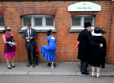 Racegoers arrive at Ascot Racecourse this week.