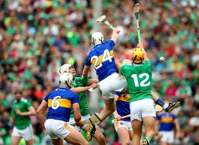 Tipperary and Limerick players battle for possession.