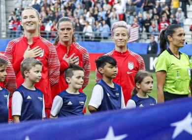 Megan Rapinoe (right) boycotts the national anthem ahead of the USA's game with Thailand.