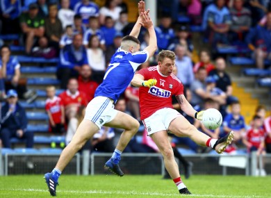 Cork's Brian Hurley and Laois defender Patrick O'Sullivan.