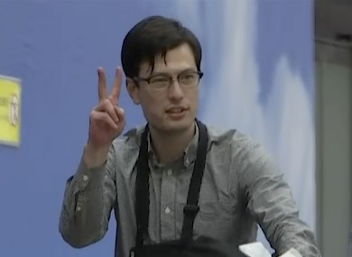 Australian student Alek Sigley as he arrives at the airport in Beijing