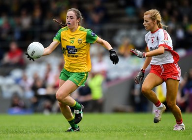 Megan Ryan of Donegal tries to get away from Tyrone's Emma Brennan at TEG Cusack Park in Mullingar, Co Westmeath.