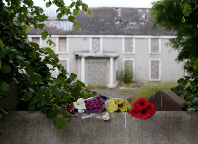 Fresh flowers at the scene outside a deserted building in Lucan where Ana Kriegel was murdered last year.