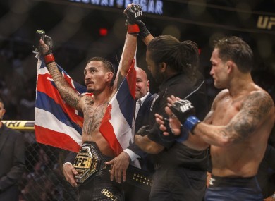 Holloway celebrates his win over Edgar in Edmonton.