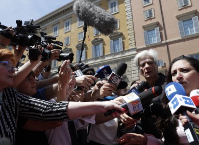 Pietro Orlandi, brother of Emanuela Orlandi, stands by Laura Sgro as she speaks to the media.