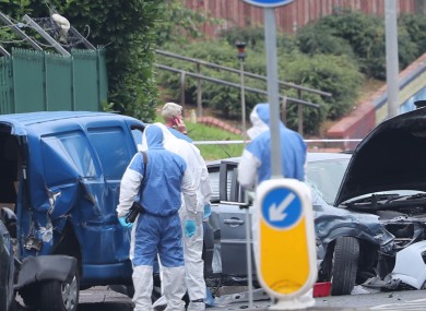 Forensic detectives investigate the scene.