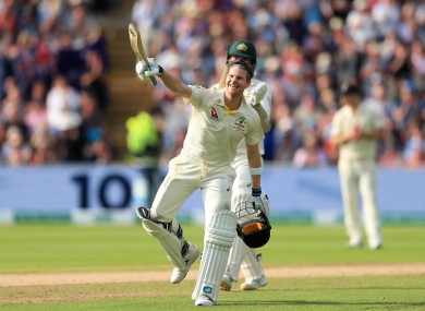 Smith celebrates his century.