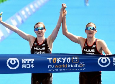 The pair crossed hand-in-hand and were late disqualified.