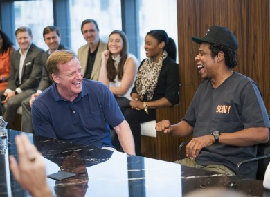 NFL Commissioner Roger Goodell, left, and Jay-Z appear at a news conference.
