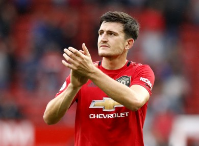 Manchester United's Harry Maguire applauds the fans.