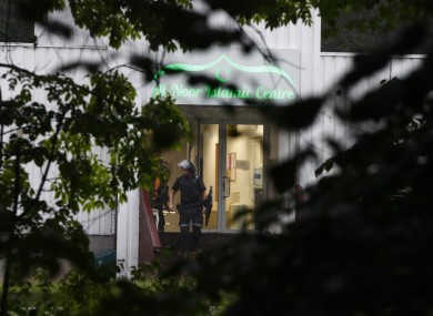 Police attend the scene after a shooting inside the al-Noor Islamic centre