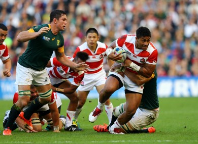 Mafi makes a carry as Japan defeated South Africa.