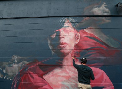 Artist Spear works as part of the Waterford Walls graffiti and street art festival.