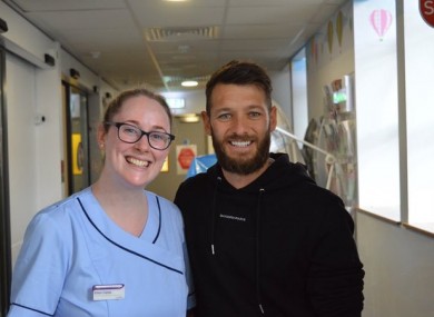 Wes Hoolahan and a staff member from Temple Street Children's University Hospital.