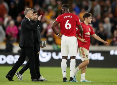 Ole Gunnar Solskjaer greets Paul Pogba after the game.