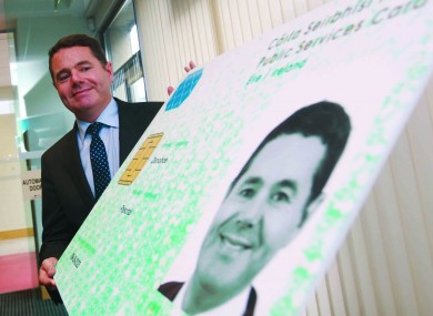 File photo. Minister Paschal Donohoe posing with a large-size PSC.