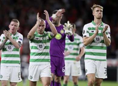 Celtic players greet supporters at the final whistle.