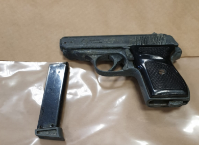 A gun seized during the search.