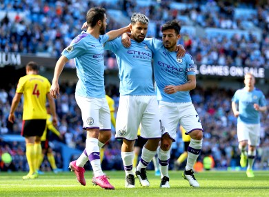 Bernardo Silva, Sergio Aguero and David Silva celebrate together.