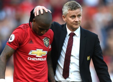 Job done: Ole Gunnar Solskjaer with Ashley Young.