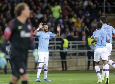 Riyad Mahrez celebrates City's opening goal.