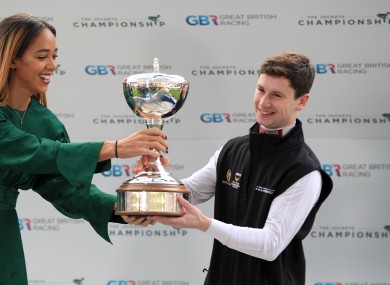 Oisin Murphy is crowned Champion Jockey by athlete Katarina Johnson-Thompson during QIPCO British Champions Day at Ascot Racecourse.