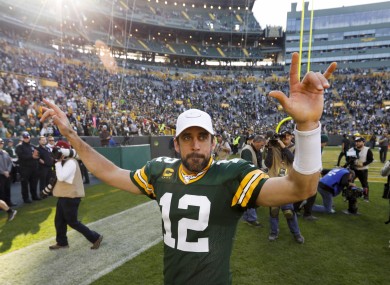 Man, myth, legend: Aaron Rodgers celebrates a career-best passing performance.