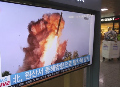 A TV screen at Seoul Railway Station shows a file image of a North Korean missile launch yesterday.