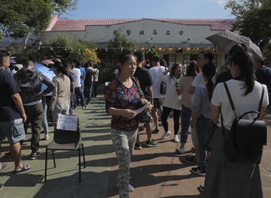 Voters queuing to cast their ballot in Hong Kong.